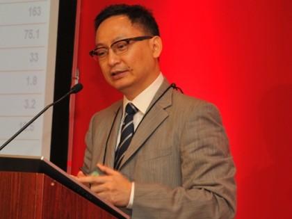 Cheung delivers a presentation at World Mail & Express Europe 2010